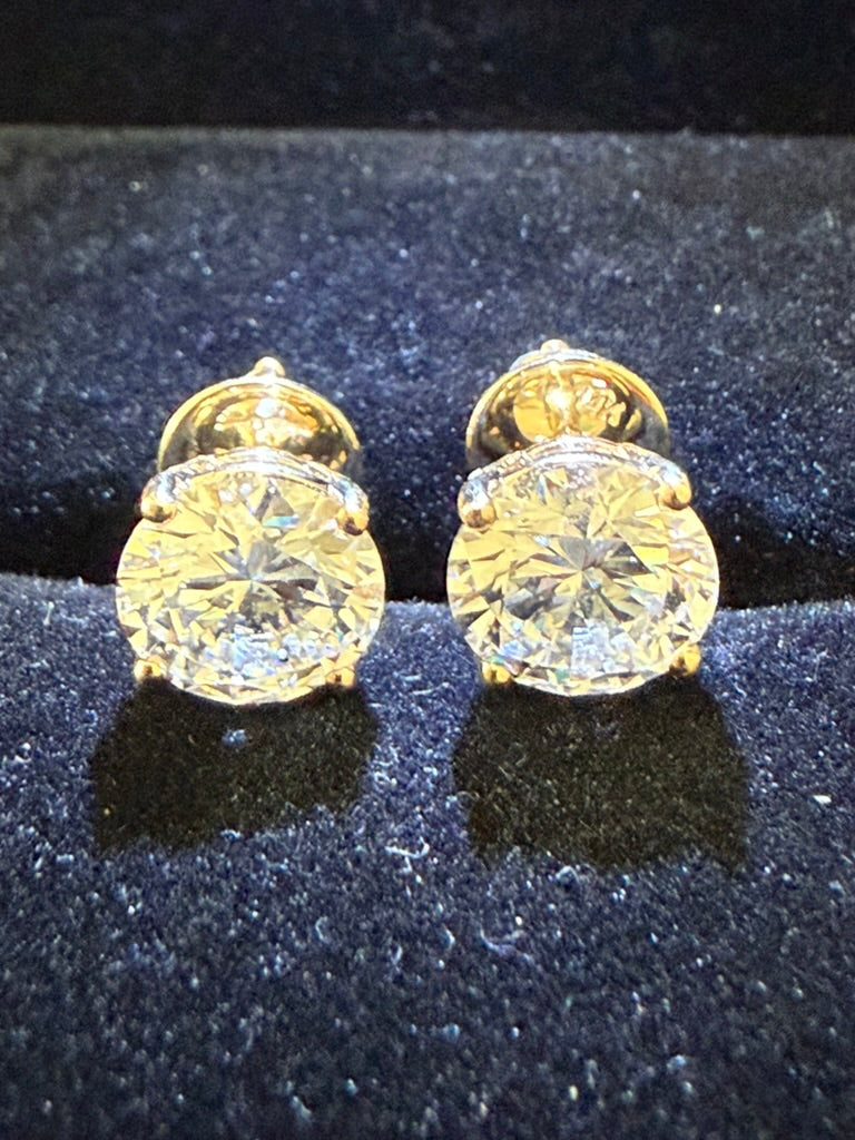 4 Total Carat Weight Diamond Earrings. Set On 4 Prong 14K Yellow Gold Setting.
