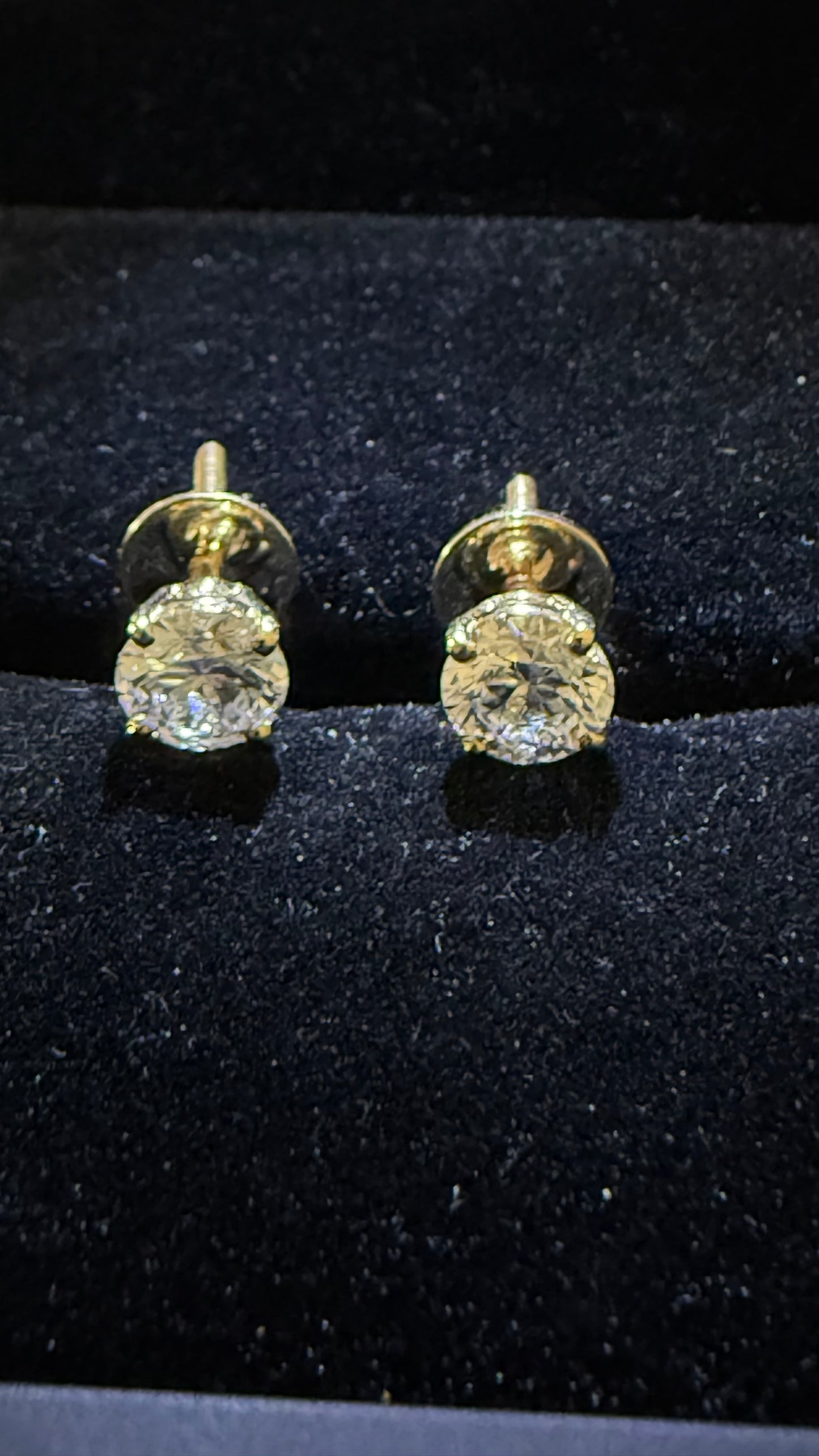 1 Total Carat Weight Round Diamond Earrings. Set On 4 Prong 14K Yellow Gold.