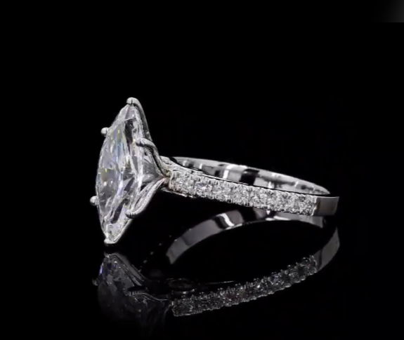 2.5 carat e vvs2 marquise center stone with half carat diamond band in 14k white gold