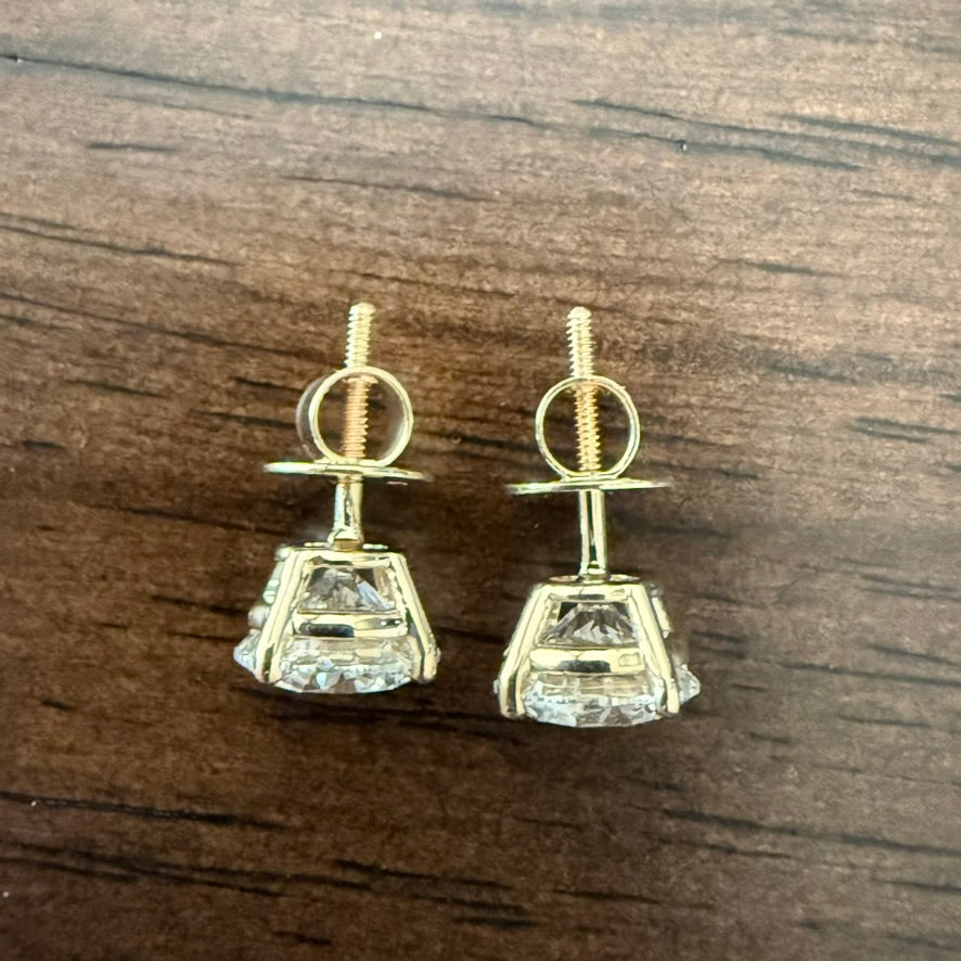 4 Total Carat Weight Diamond Earrings. Set On 4 Prong 14K Yellow Gold Setting.