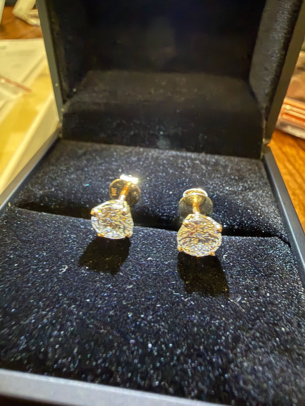 2 Total Carat Weight Round Diamond Earrings. Set With 4 Prong 14K Yellow Gold Setting.