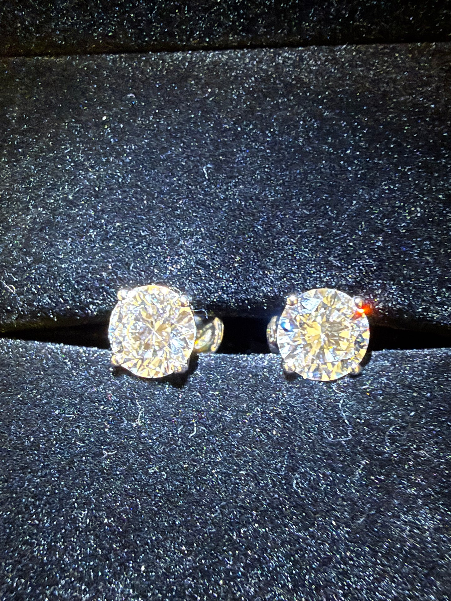 2 Total Carat Weight Round Diamond Earrings. Set With 4 Prong 14K Yellow Gold Setting.