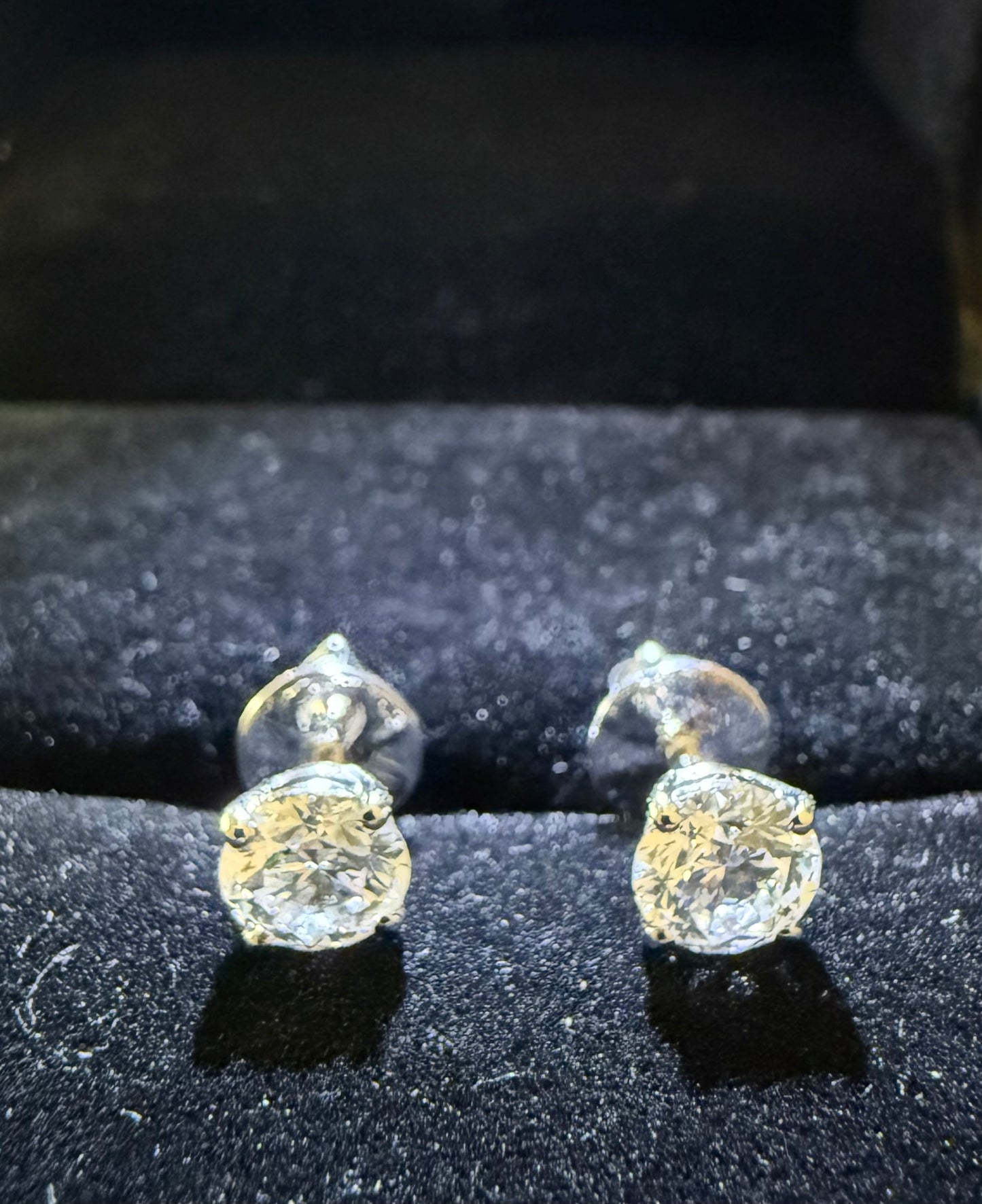 1 TCW Round Diamond Earrings.
