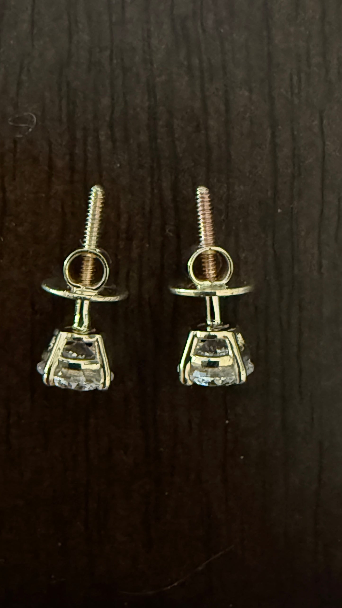 1 Total Carat Weight Round Diamond Earrings. Set On 4 Prong 14K Yellow Gold.