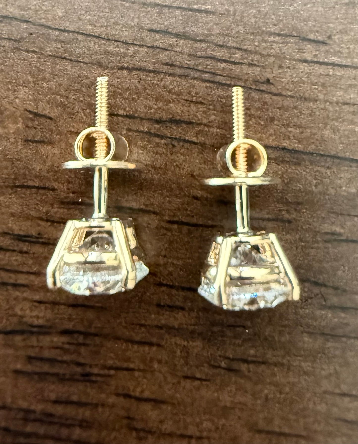 3 Total Carat Weight Round Diamond Earrings, E/VS1. Set On 4 Prong 14K Yellow Gold Setting.