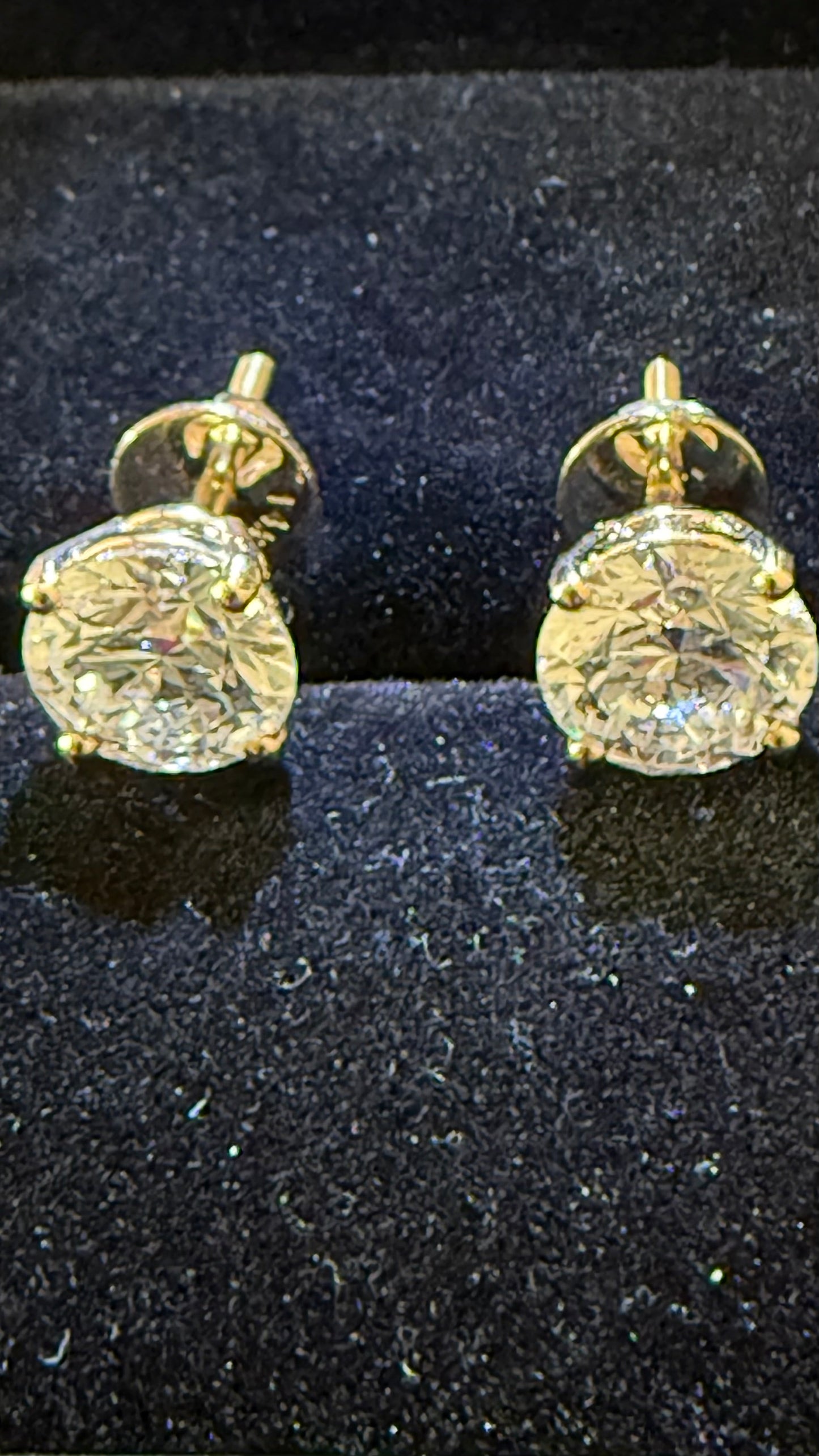 3 Total Carat Weight Round Diamond Earrings, E/VS1. Set On 4 Prong 14K Yellow Gold Setting.