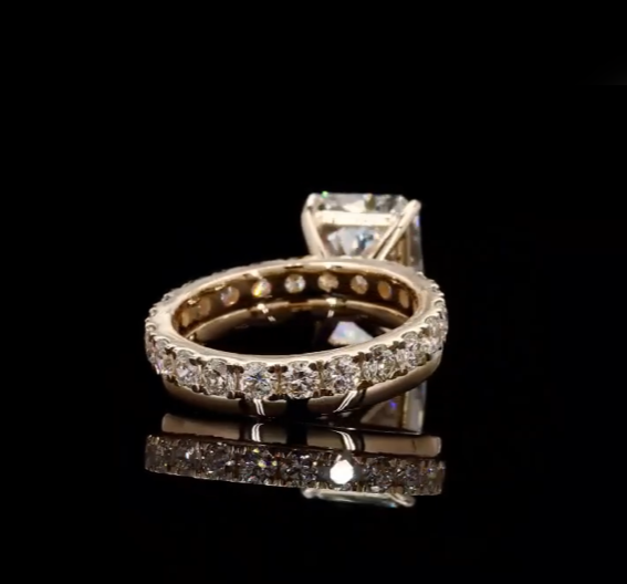 4 carat e vs1 radiant center stone on a 14k yellow gold solitaire band   Paired with a 14k yellow gold 2 carat eternity band