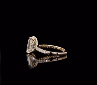 3 carat e vvs2 radiant on a 14k yellow gold half carat diamond band with diamond hidden halo