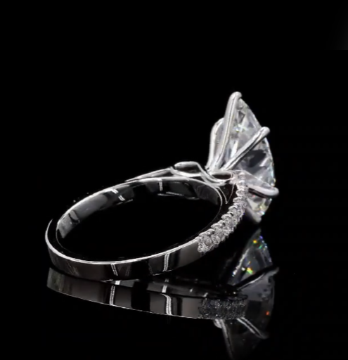 2.5 carat e vvs2 marquise center stone with half carat diamond band in 14k white gold