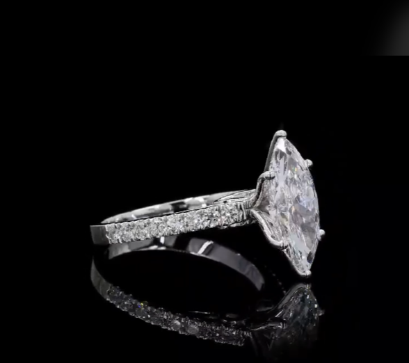 2.5 carat e vvs2 marquise center stone with half carat diamond band in 14k white gold
