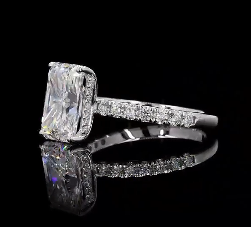 3 carat e vvs2 radiant on a 14k White gold half carat diamond band with diamond hidden halo