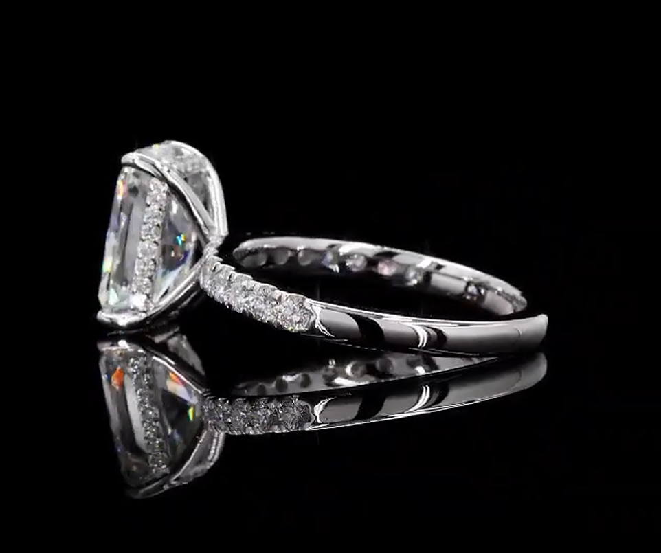 3 carat e vvs2 radiant on a 14k White gold half carat diamond band with diamond hidden halo