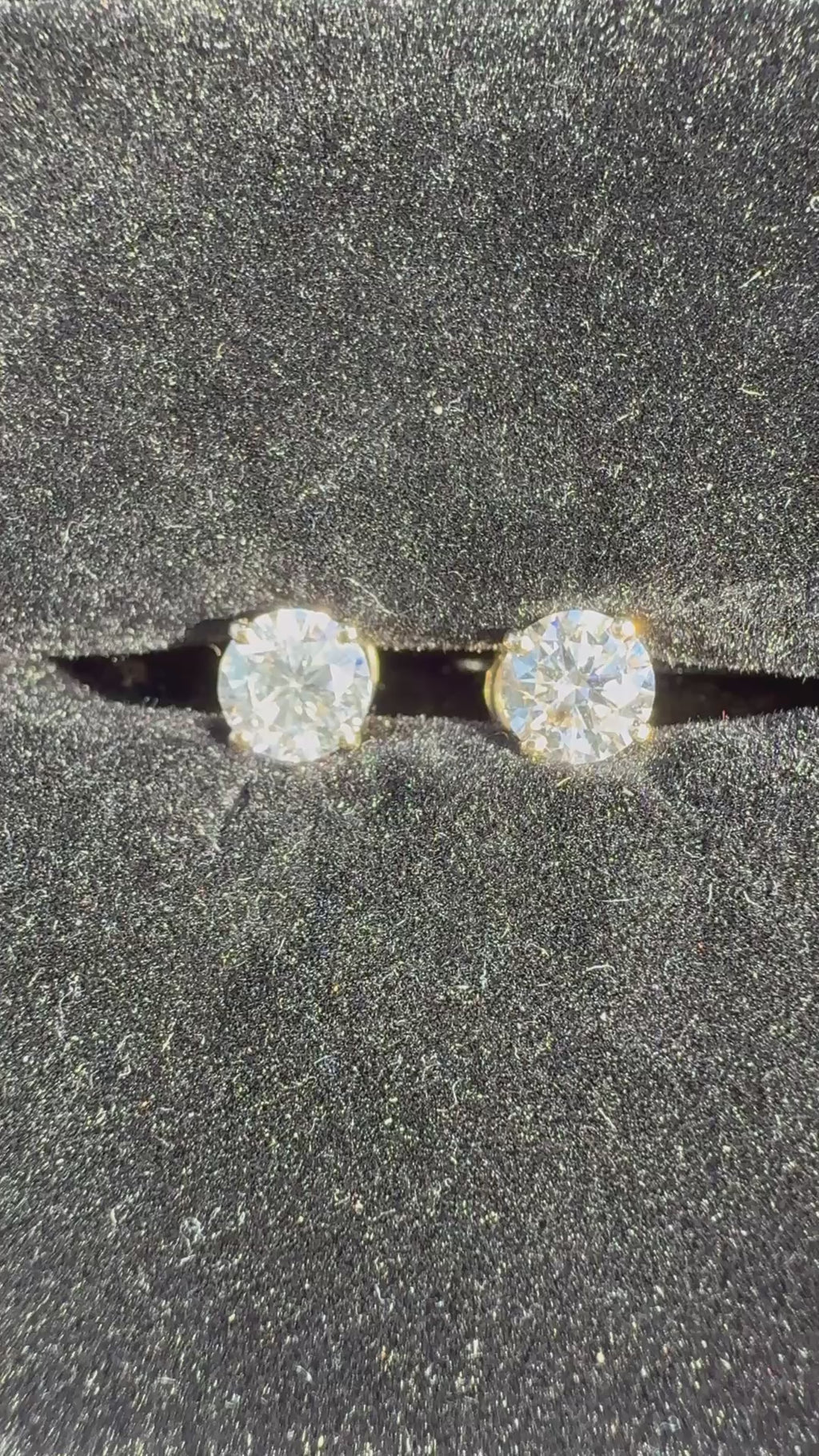 1 Total Carat Weight Round Diamond Earrings. Set On 4 Prong 14K Yellow Gold.