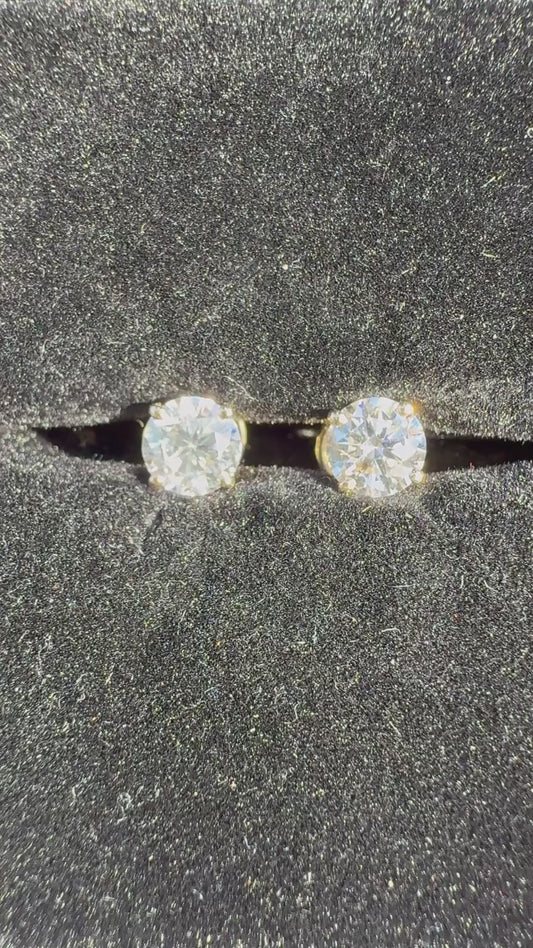 1 Total Carat Weight Round Diamond Earrings. Set On 4 Prong 14K Yellow Gold.
