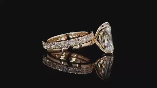 4 carat e vs1 radiant center stone on a 14k yellow gold solitaire band   Paired with a 14k yellow gold 2 carat eternity band