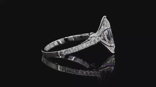 2.5 carat e vvs2 marquise center stone with half carat diamond band in 14k white gold