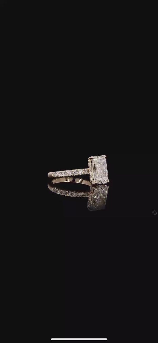 3 carat e vvs2 radiant on a 14k yellow gold half carat diamond band with diamond hidden halo