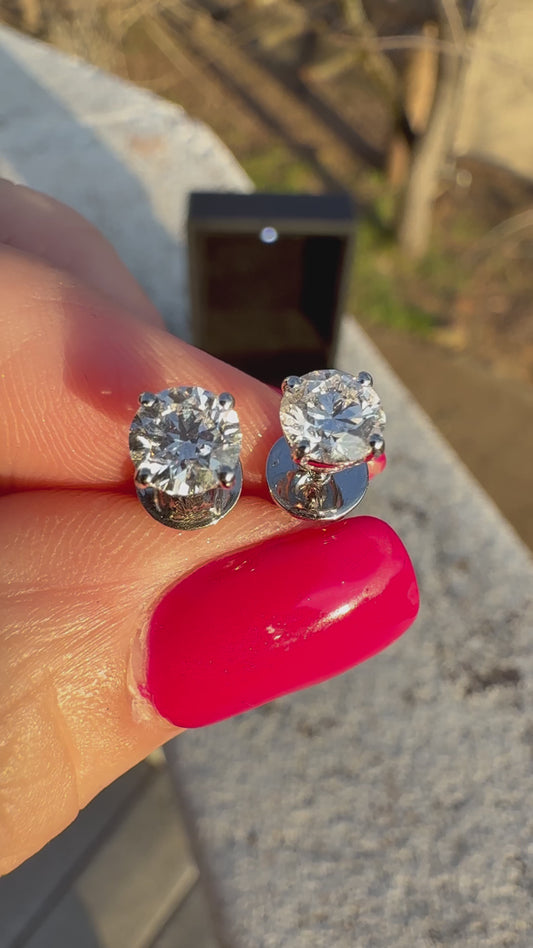 1 TCW Round Diamond Earrings.