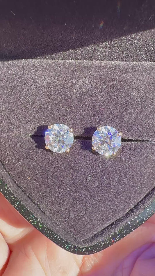 3 Total Carat Weight Round Diamond Earrings, E/VS1. Set On 4 Prong 14K Yellow Gold Setting.
